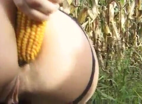 German lady peeing and pooping in a cornfield..