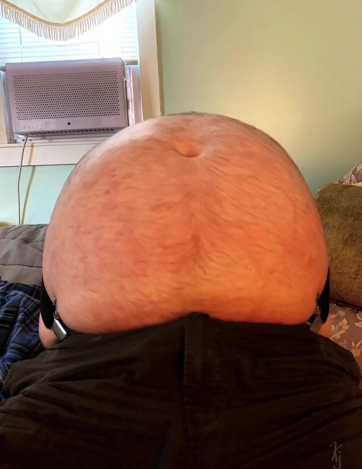 man's big round belly getting huge