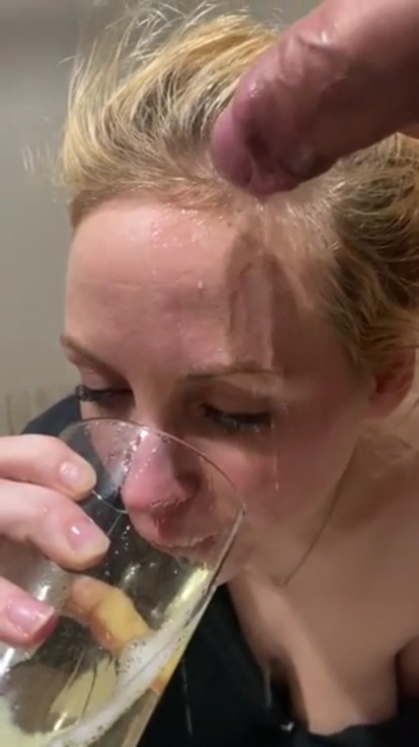 Submissive blonde drinks a glass of piss