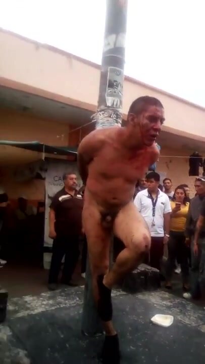 Naked Thief Tied on Pole Beeing Humiliated
