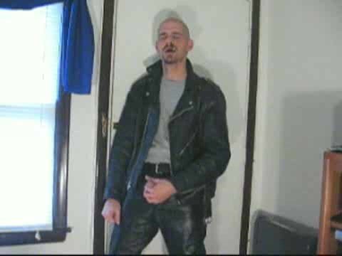 Shaved cigar dad in leather takes out cock and wanks