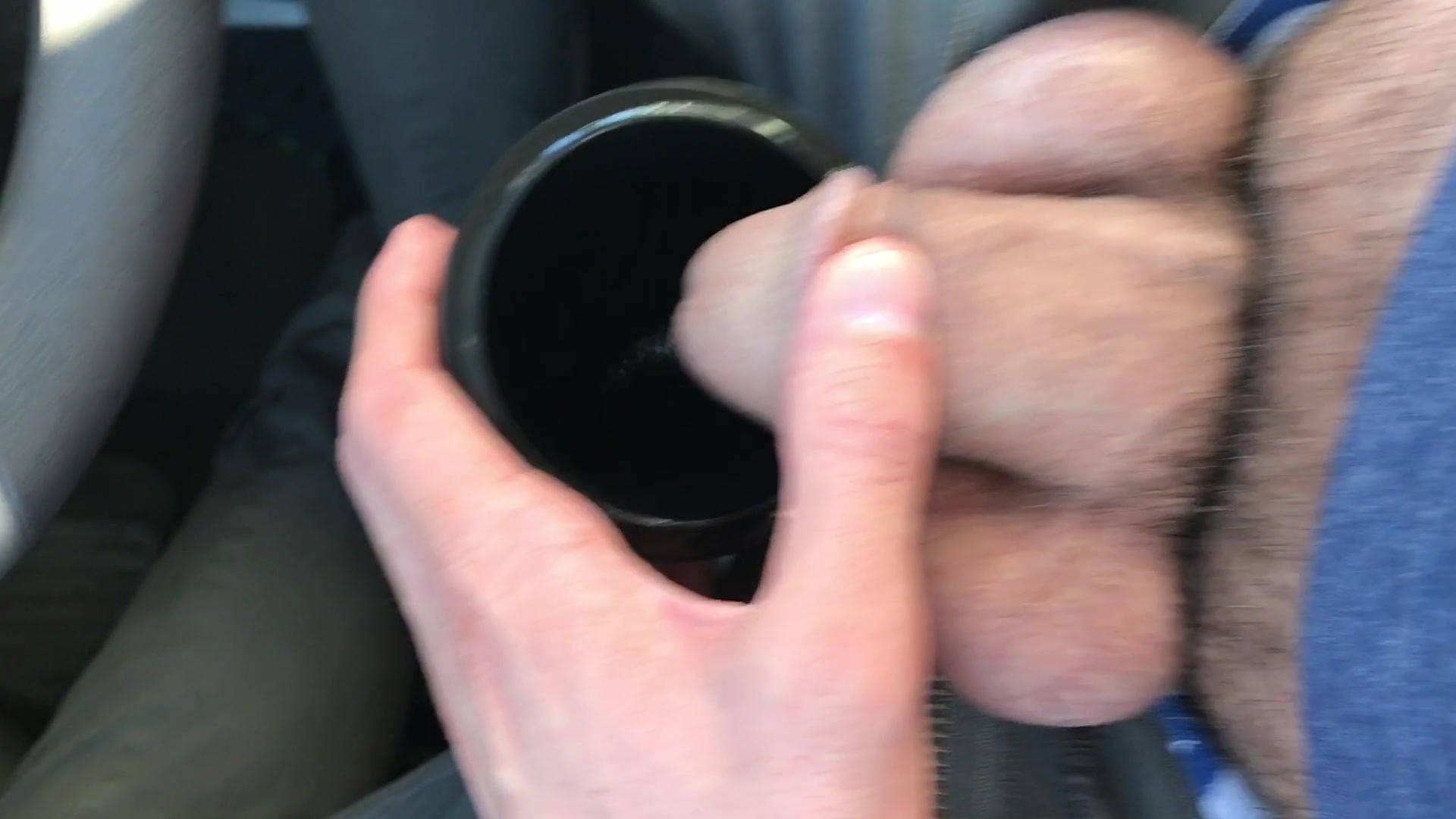 Pissing in a cup in the car