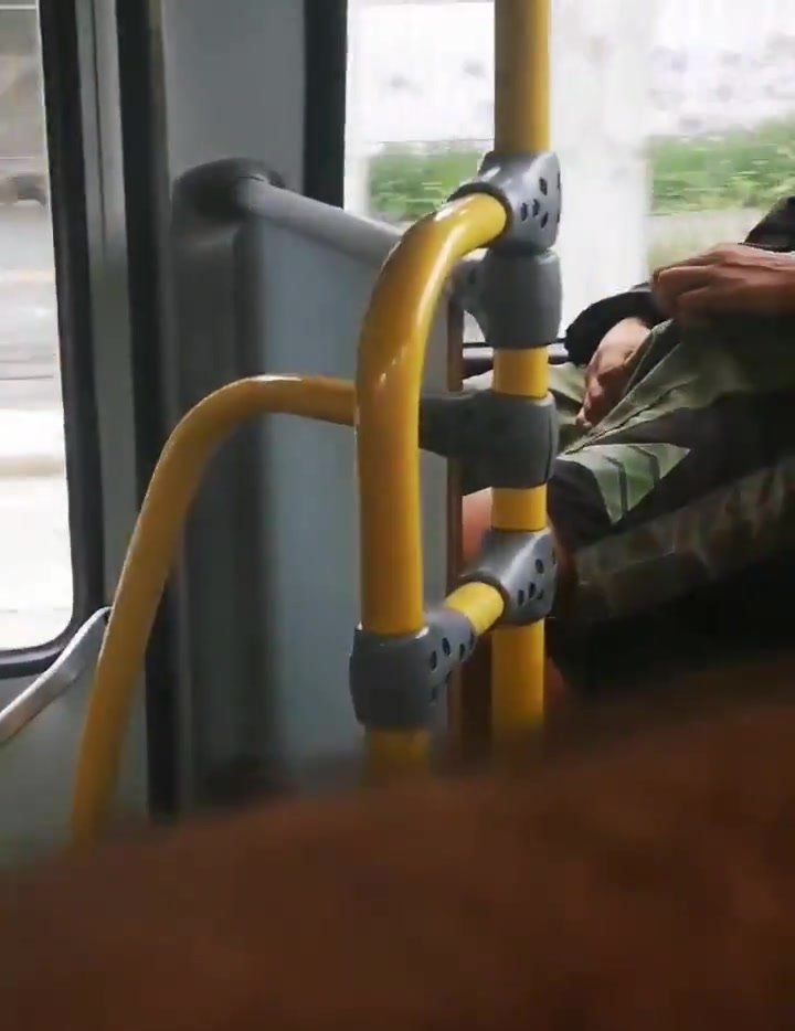 He is playing with his boner on the bus (no nudity)