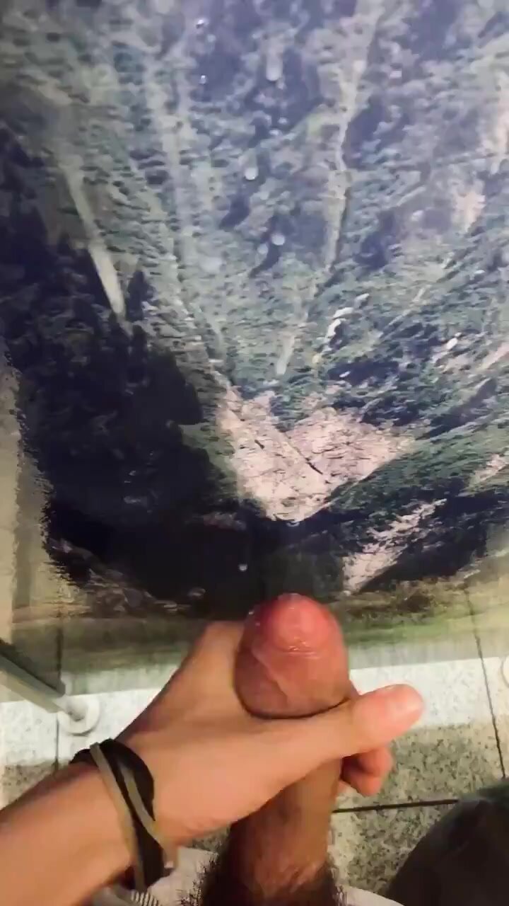 Guy Painting The Public Bathroom Stall