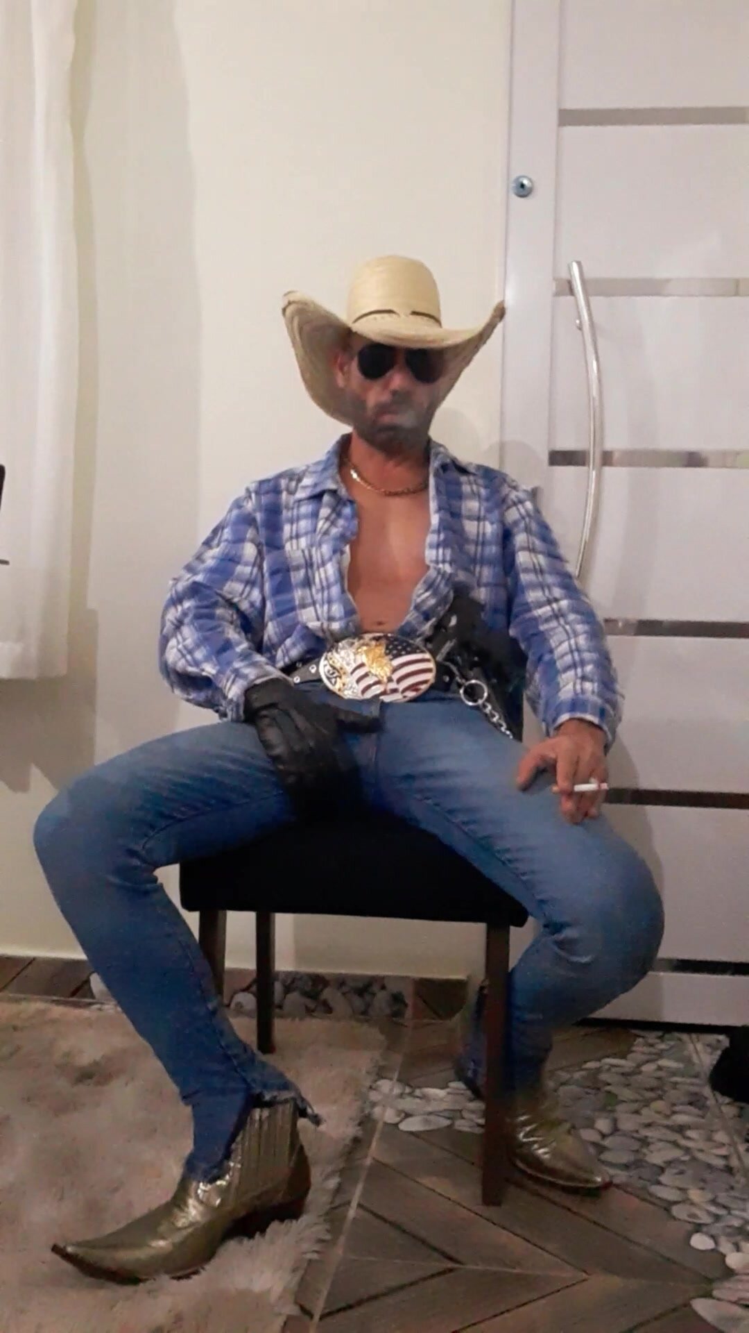 Redneck in style, smoking and showing off on cam.