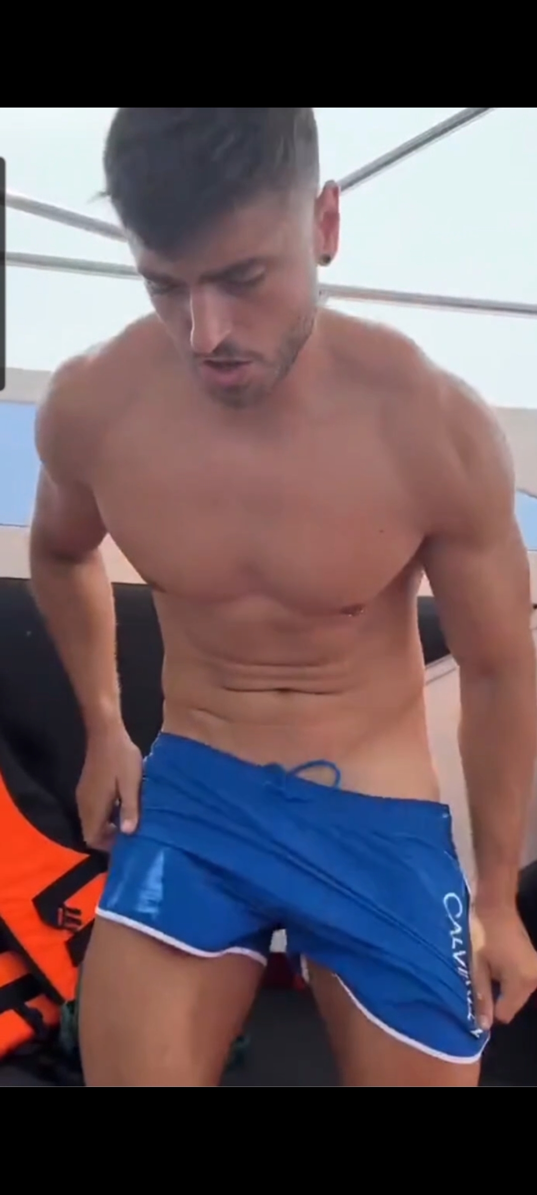 Sexy guy strips on aboat