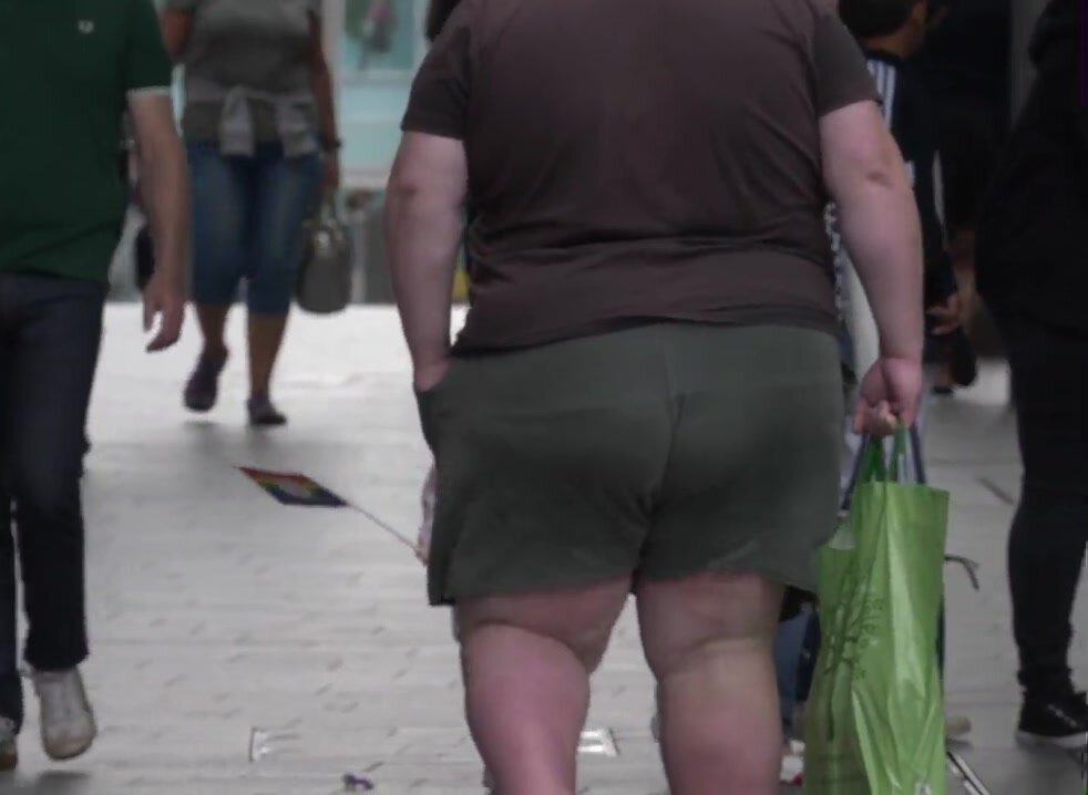 Super obese guy walking in street