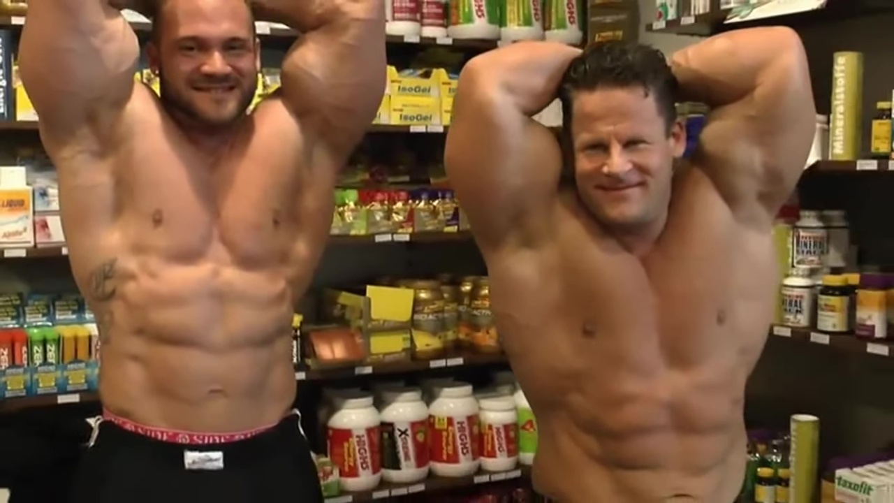 Famous German Bodybuilder Posing with Friend