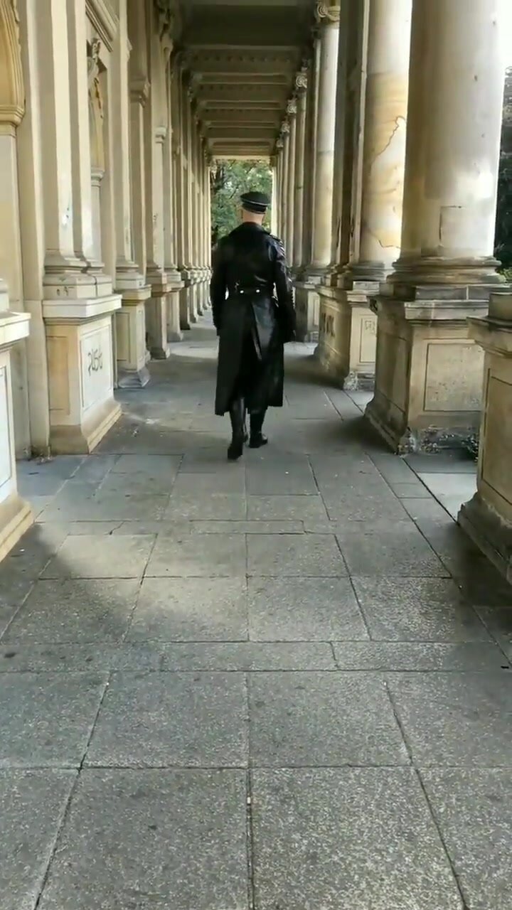 Leather Officer walking around in his leather uniform.