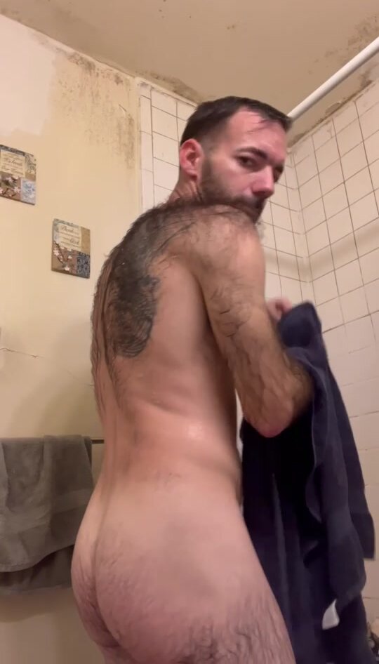 Hairy daddy drying off after shower