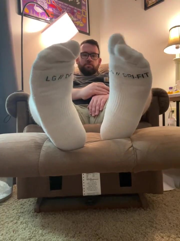 Handsome Alpha shows off his white socked soles