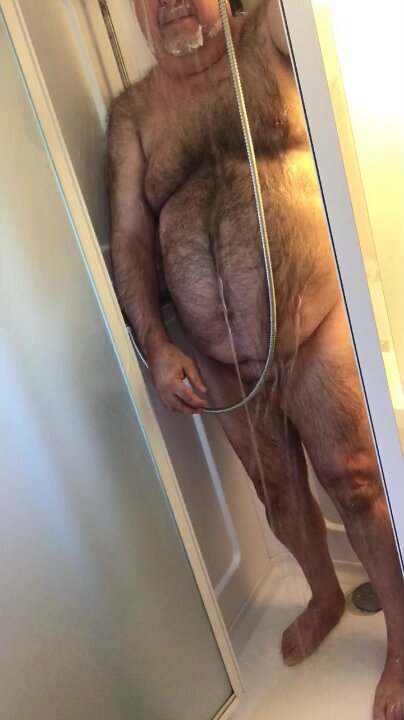 Hairy daddy showers and cums