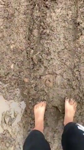 Teen girl has fun in the mud!