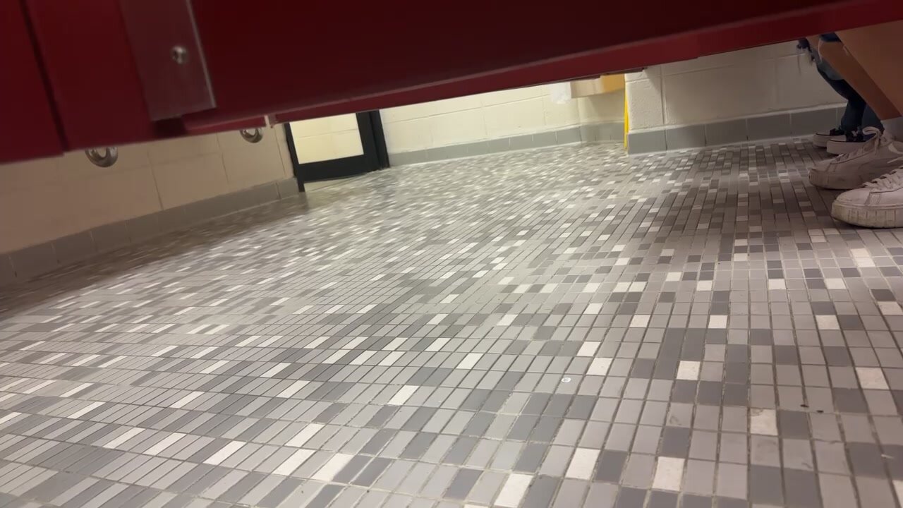 2 girls pissing inside University Bathroom