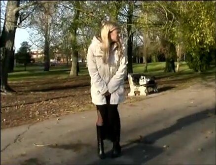 Girl pisses right beside a bench