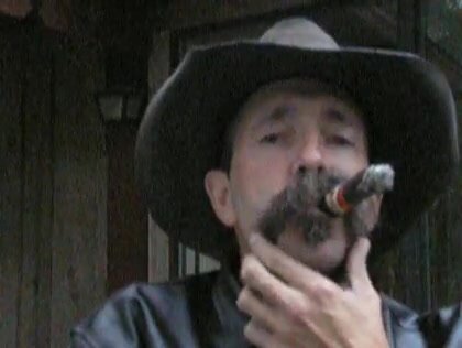 Handsome cigar smoking leather cowboy dad 2