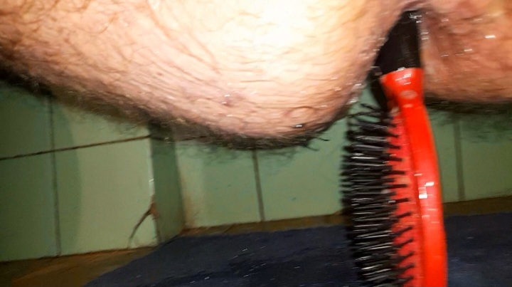 Comb in hairy ass
