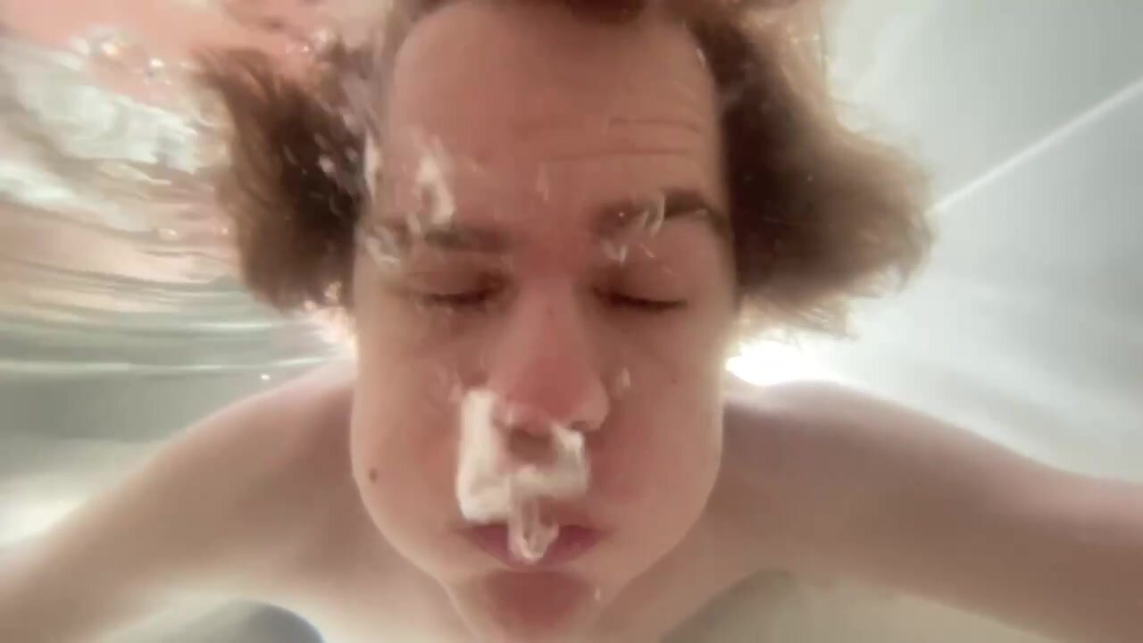 Guy Blowing Bubbles Underwater In The Tub