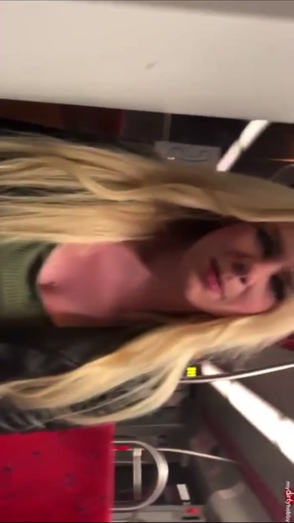 blonde woman pees in the jeans in the tram