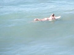 Girl surfs naked