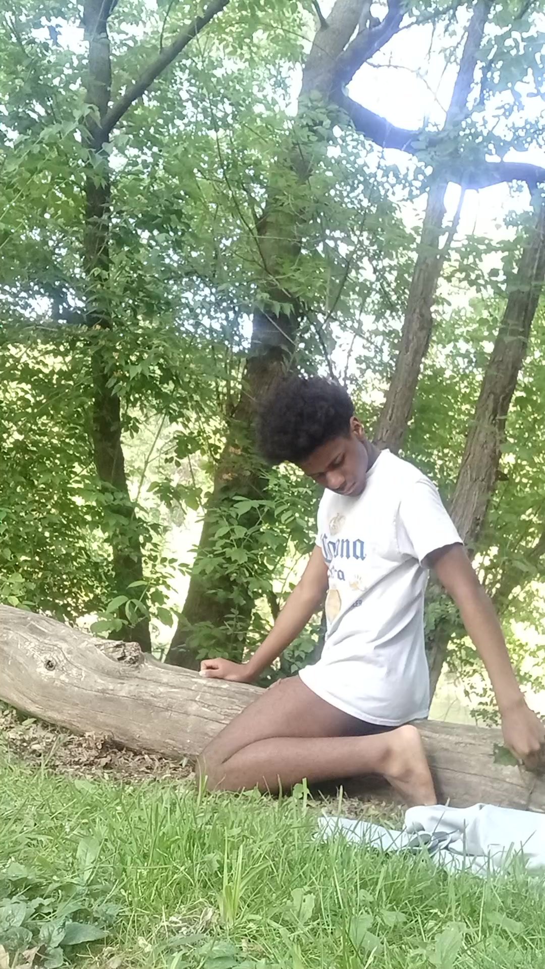 Black teen humping a log