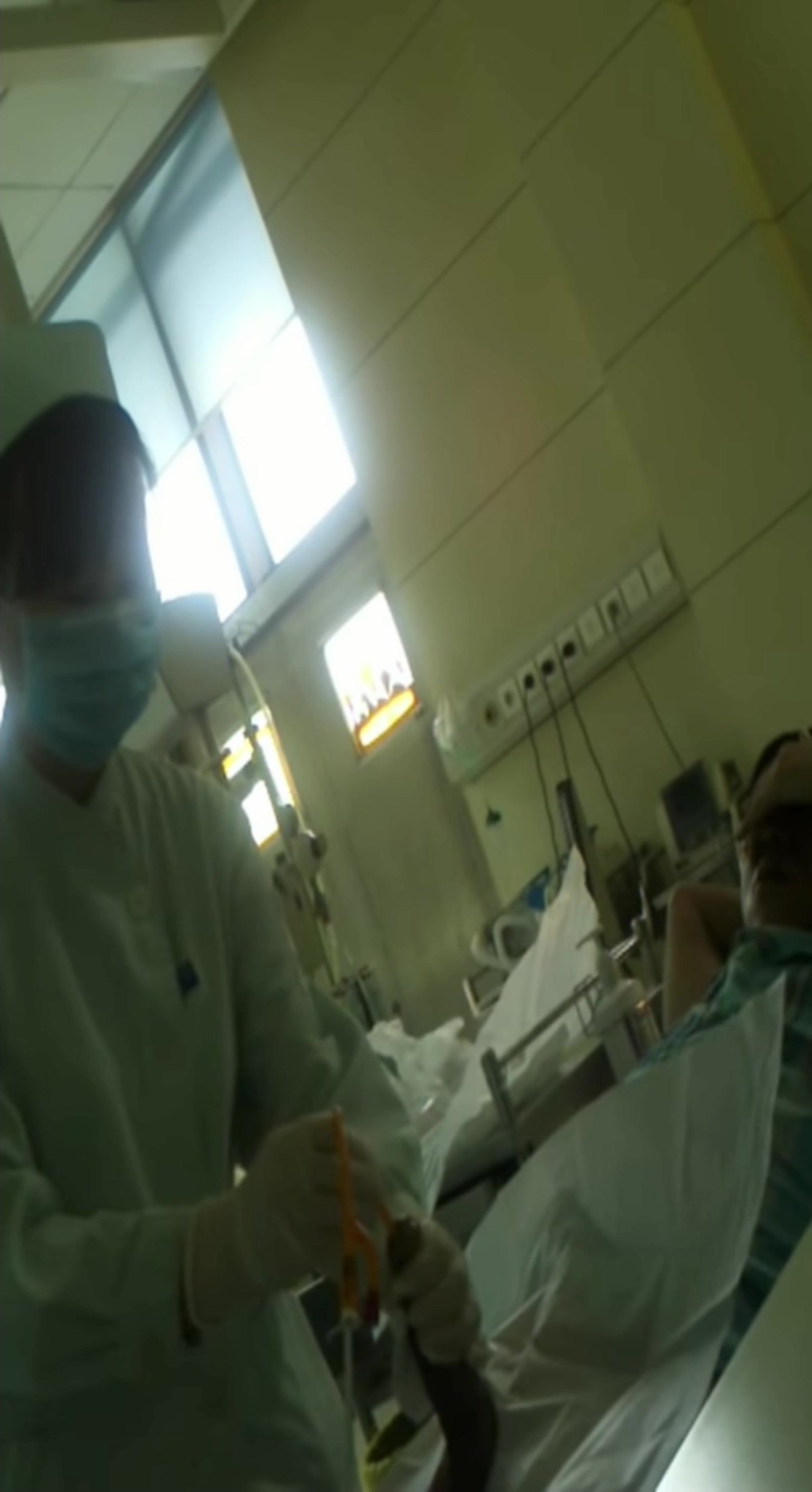 Nurse Placing Catheter with Erection