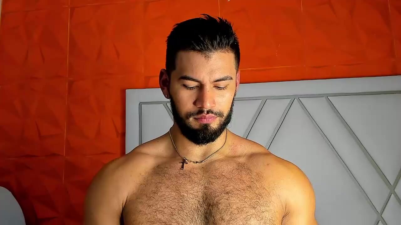 latin muscle hunk jerking off in bed