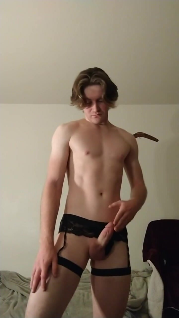 Boy with medium length hair in lingerie jerks off