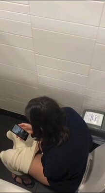 Voyeur young woman shitting in toilet