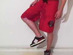 Pissing red Surf Shorts and Globe sneakers