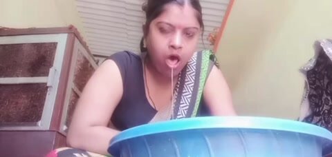 Indian woman vomits