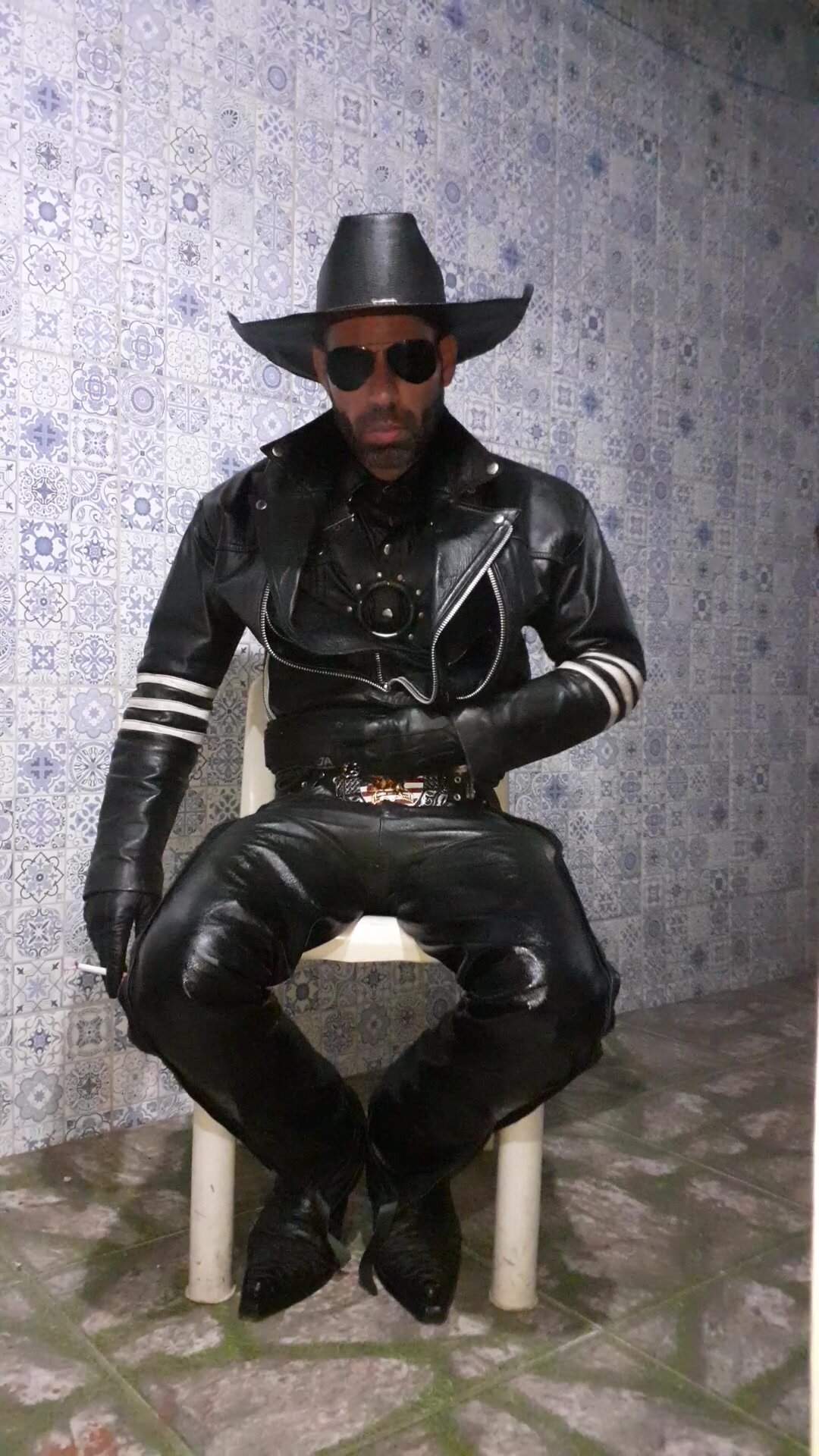 Cowboy with several layers of leather, smoking marlboro