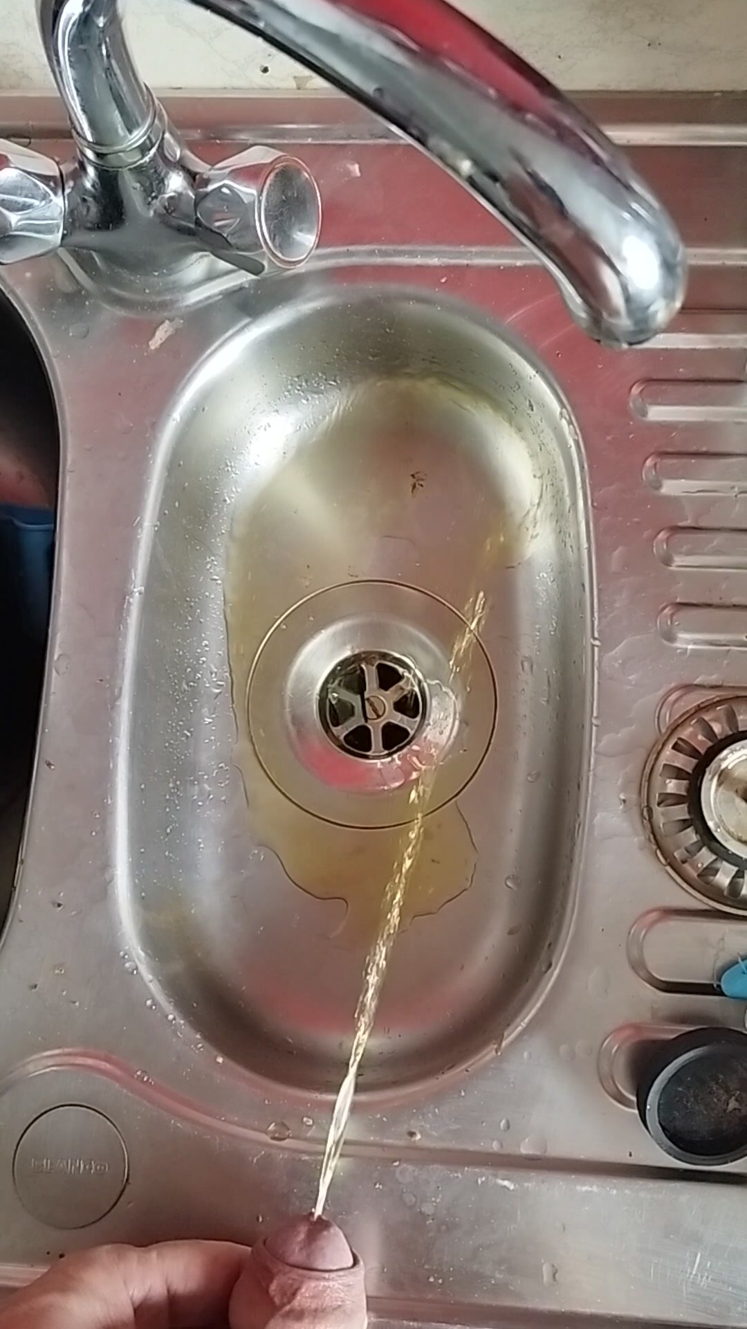 Morning dark yellow pee in the sink