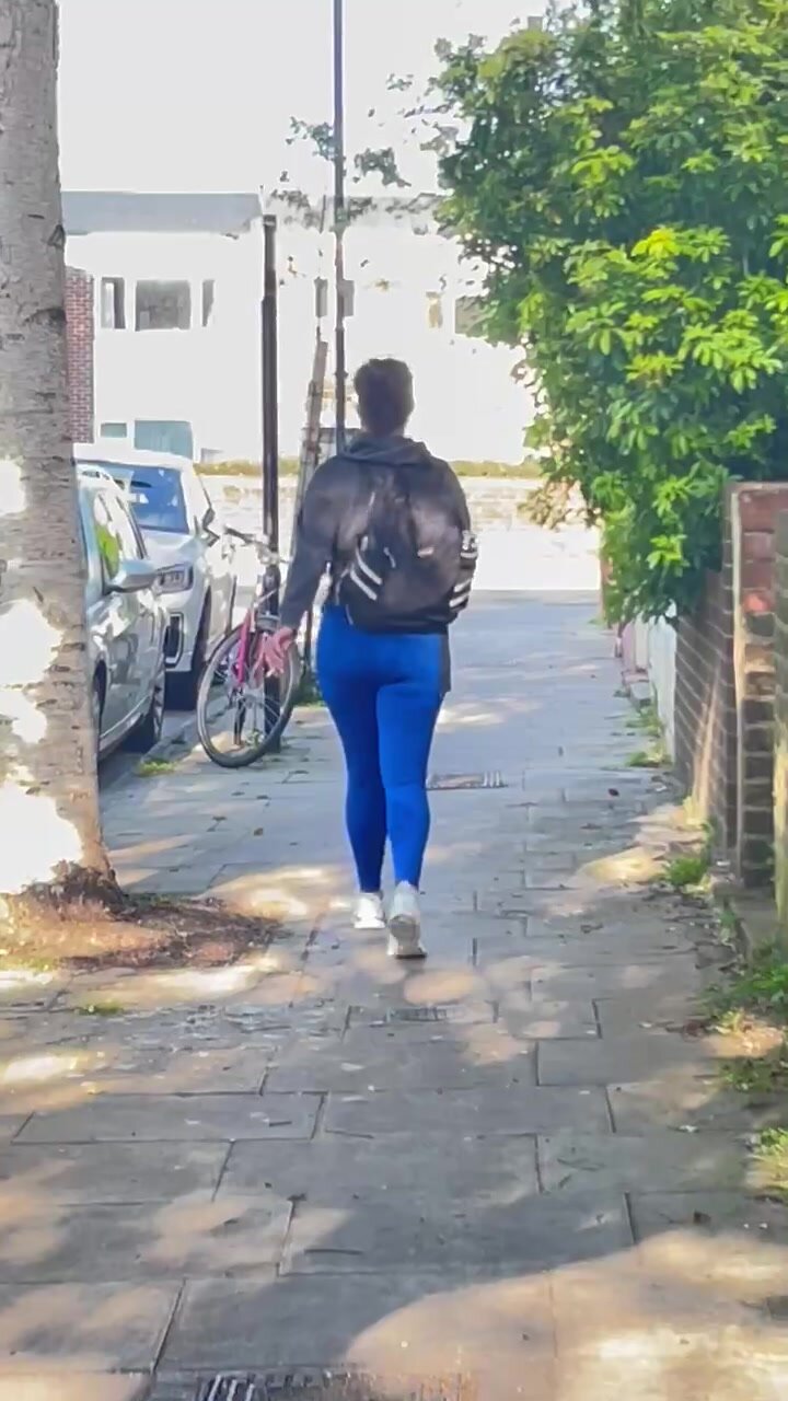 Slim brunette in blue leggings