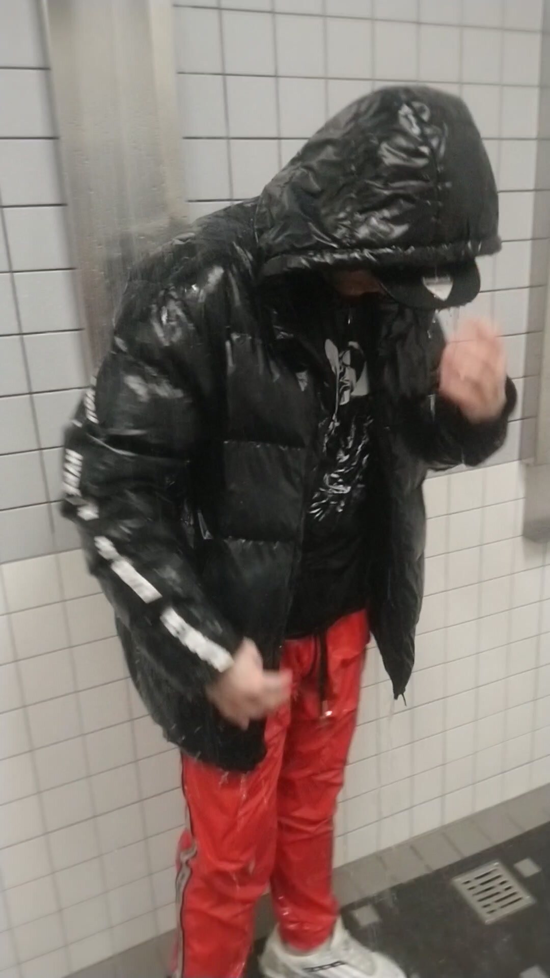 Shower in Puffer jacket and pvc pants