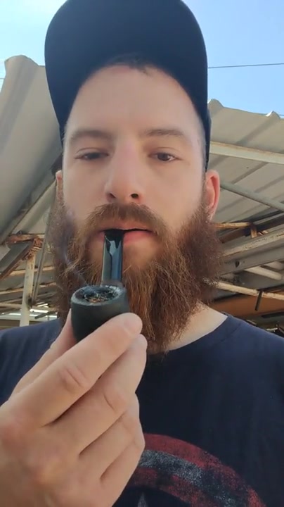 bearded pipe smoker