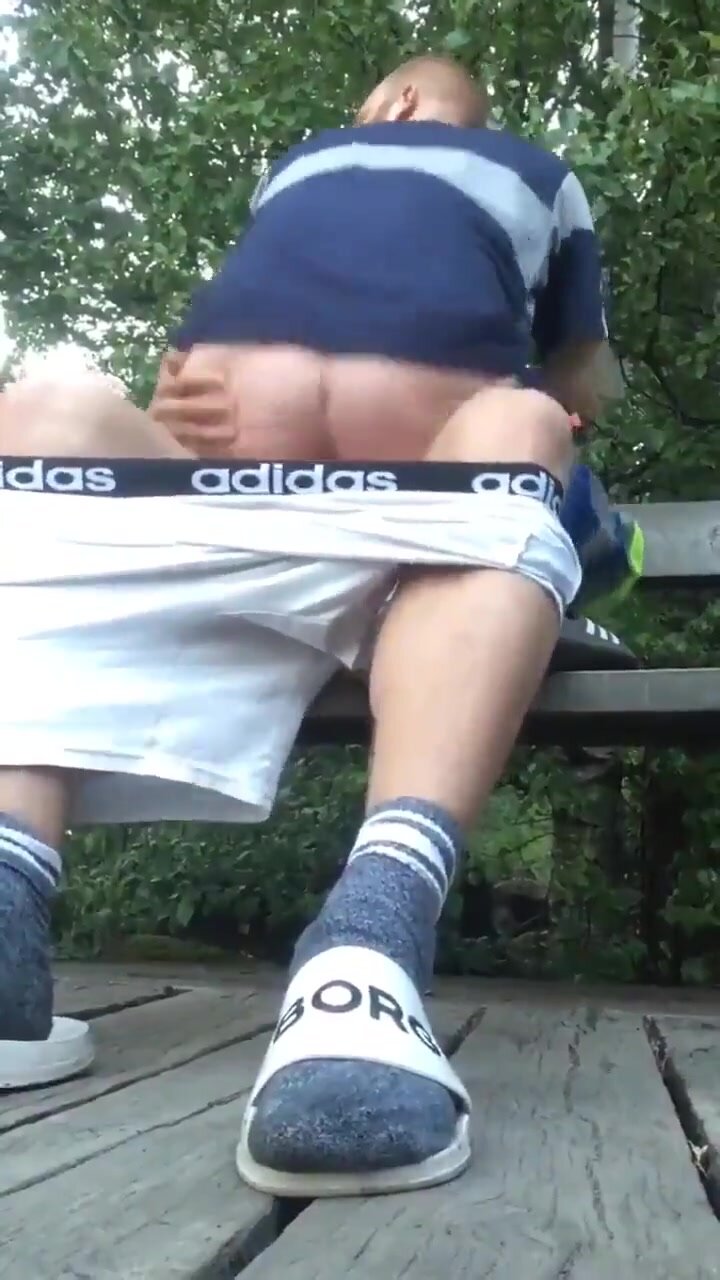 Horny lads fuck on public park bench