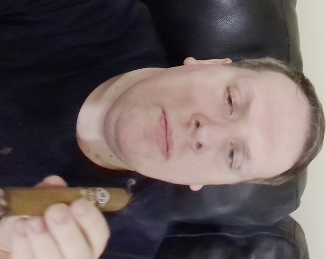 Master smokes Monetcristo cigar
