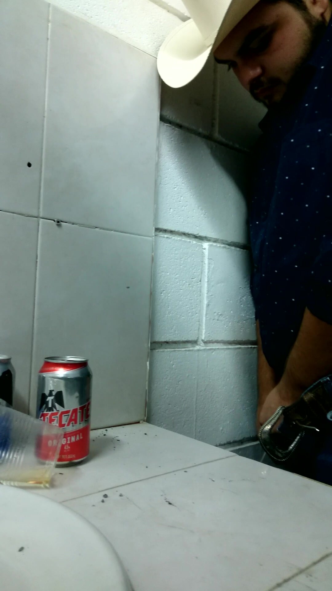 Bearded Guy pissing in front of other guys
