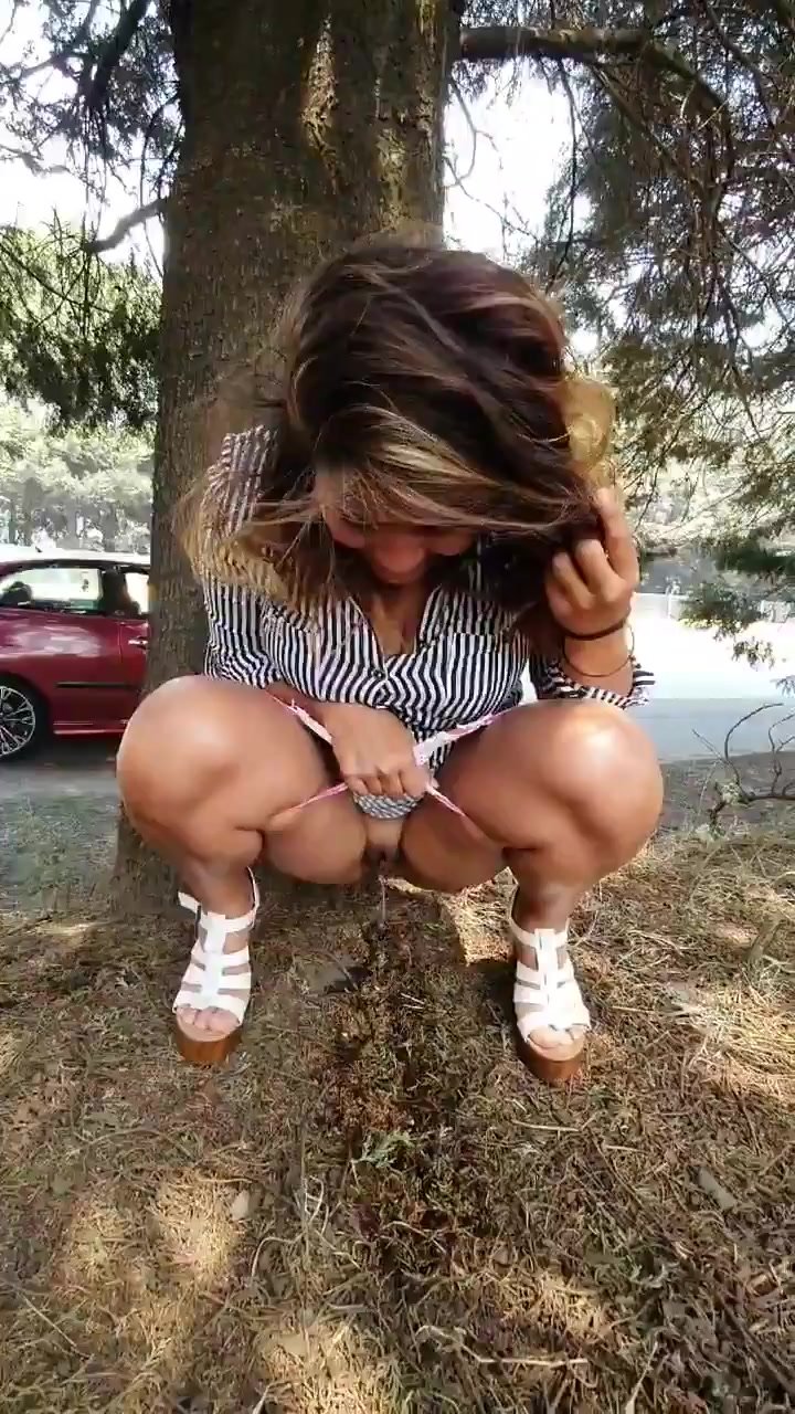 Sexy latina pulls to side of road, pees behind tree