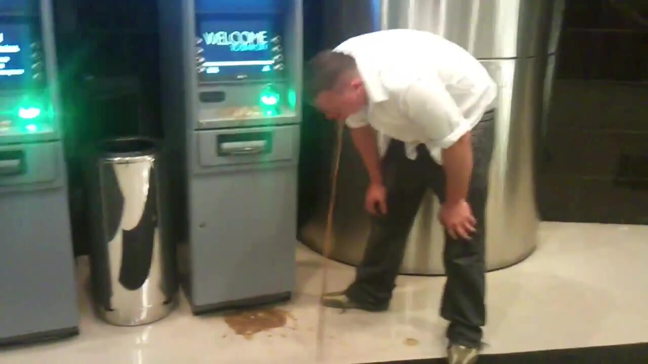 Guy Pukes On ATM Machine