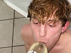 Blond boy drinking by a makeshift funnel