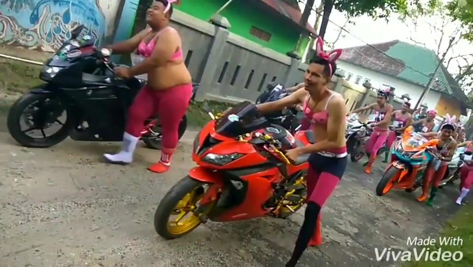Straight guys dressed in lingerie dragging motorbikes