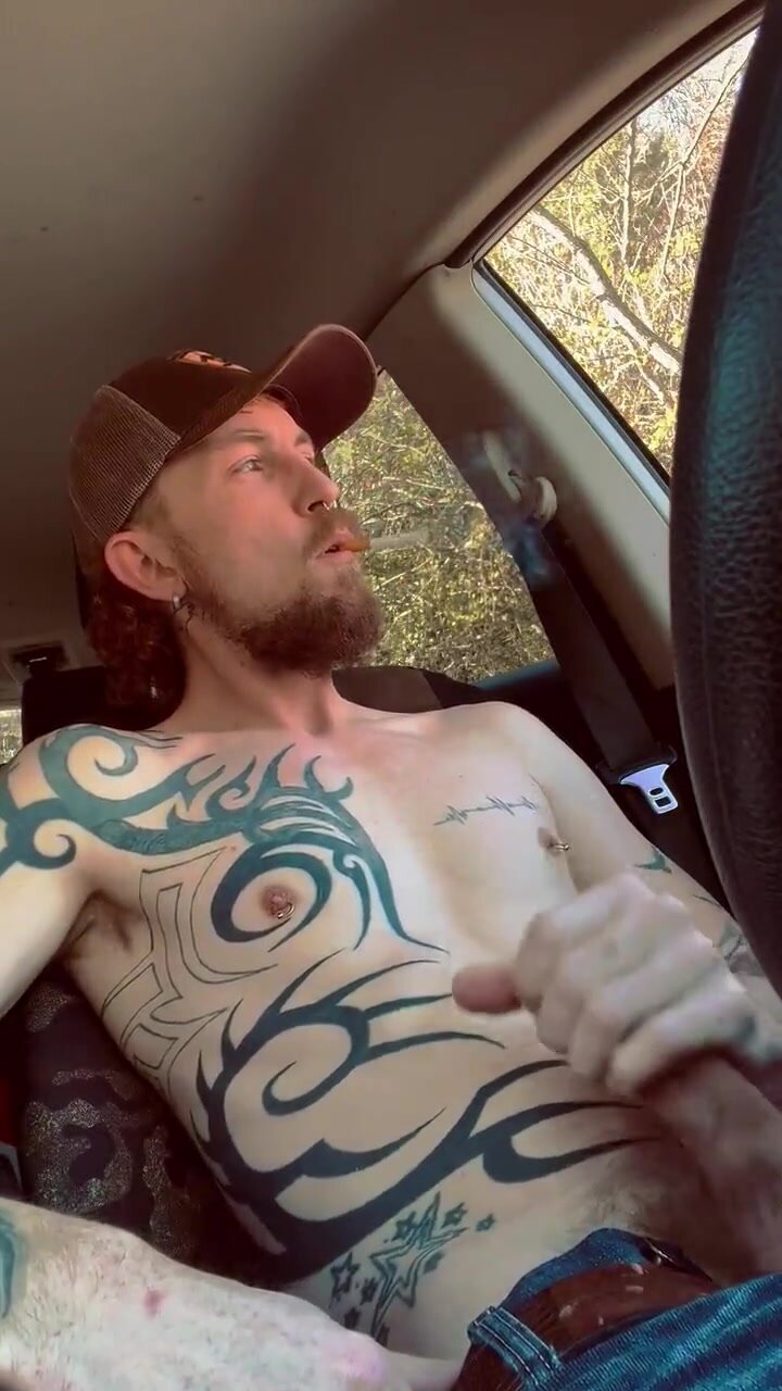 Country boy in car smokes and has a wank until he comes