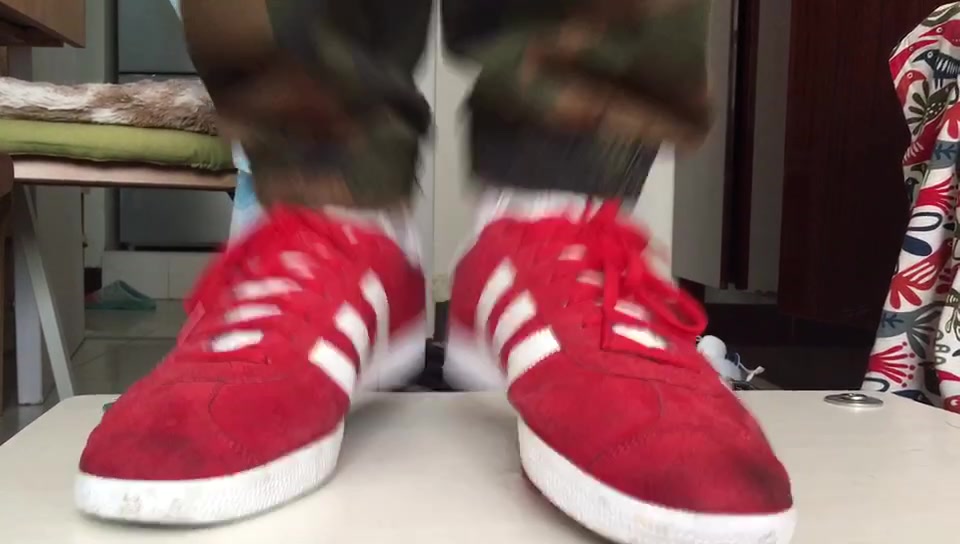 Red Basketball Shoes Stepping on Cocks