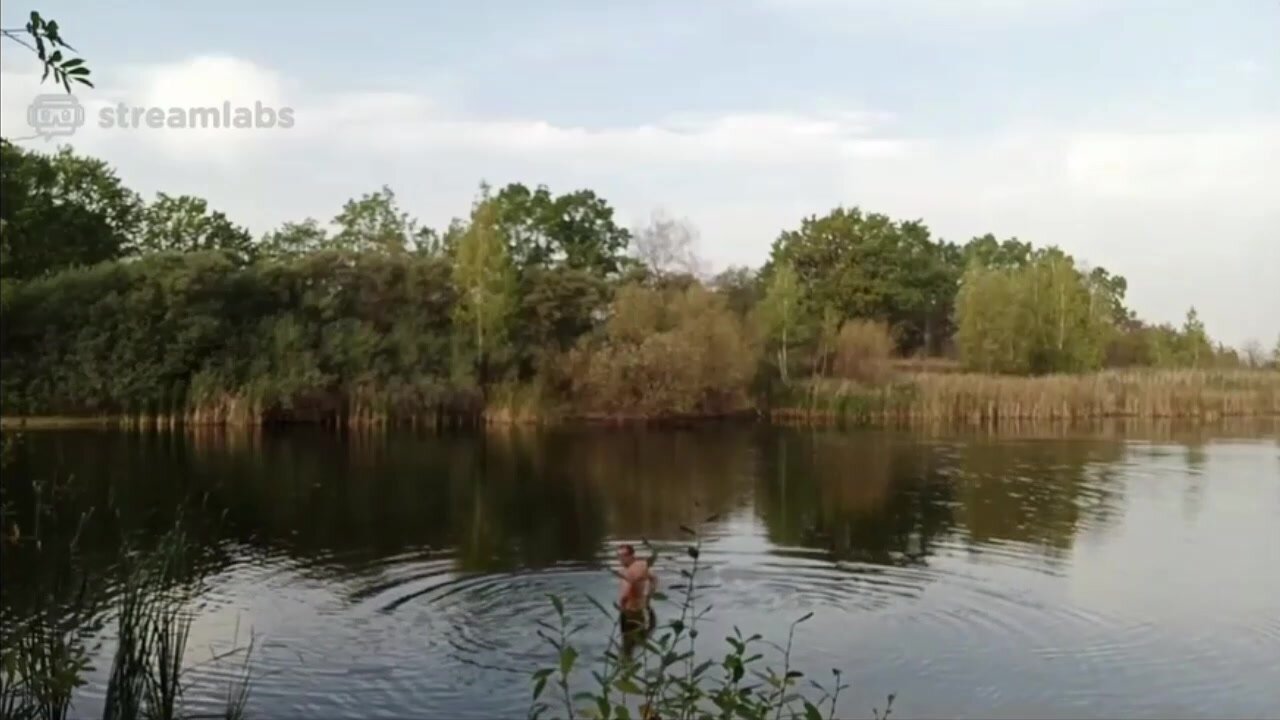Man naked in a lake