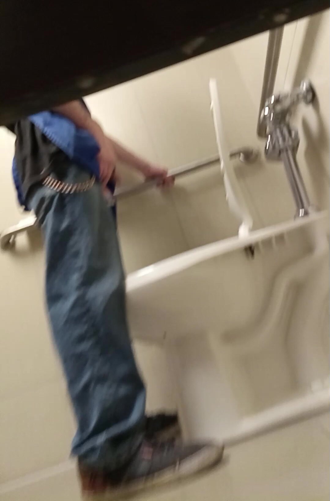 Store worker taking a quick piss