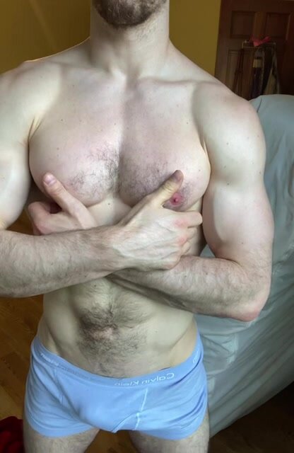 hot muscled guy playing with his nipple