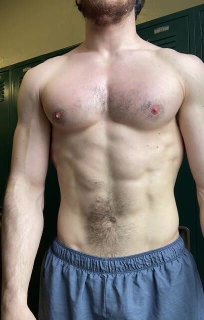 hot muscled guy playing with his pecs and nipple