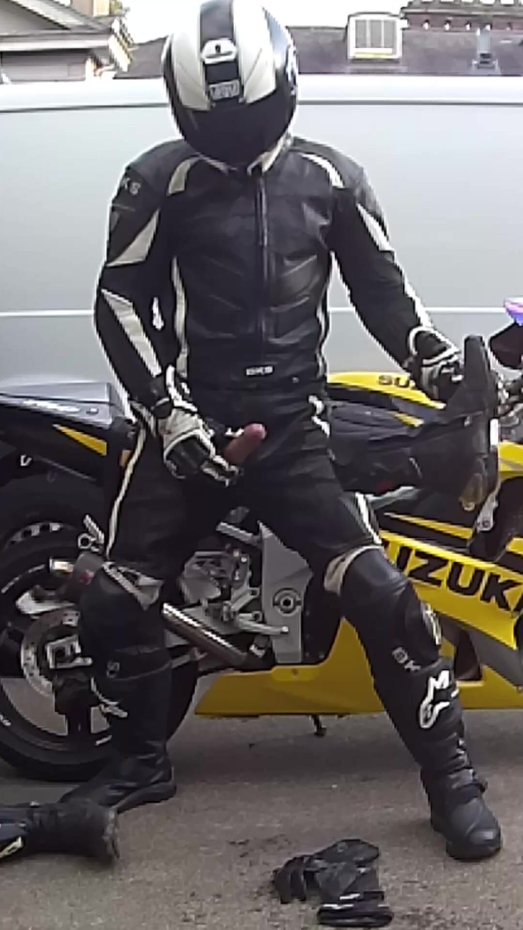 Biker pisses, wanks and cums over his gear